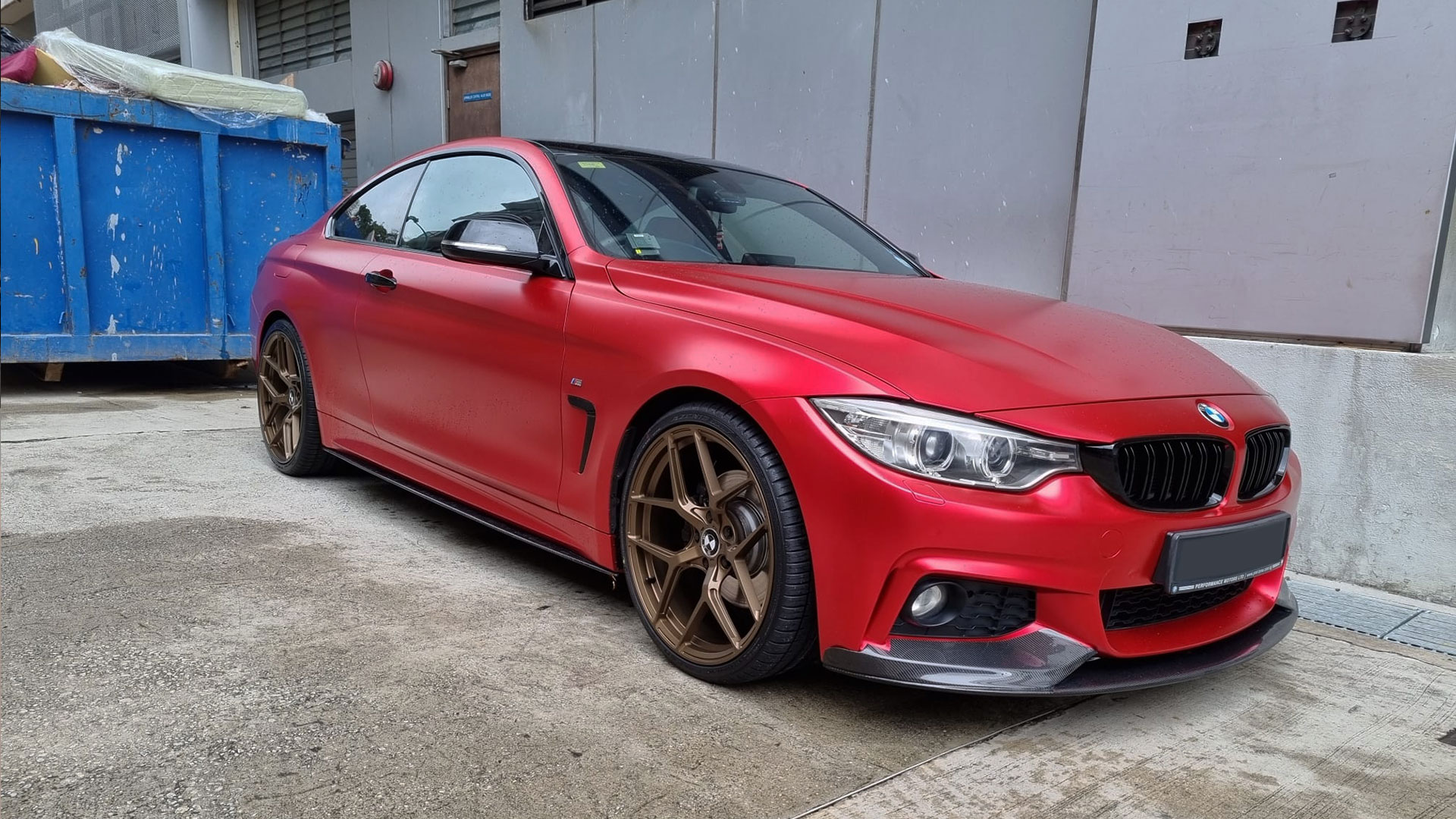 A red BMW 4 series F32 on 20 inch monoblock Custom Forged Wheels in bronze finish